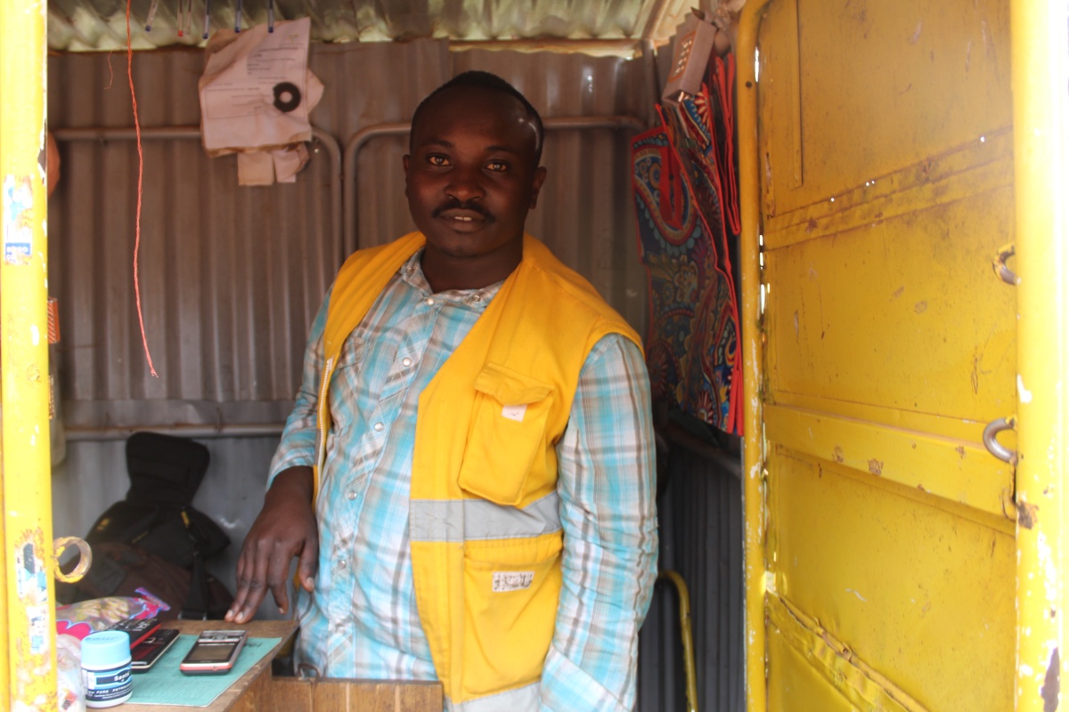 Cancer survivor Bizinde Elyse runs a small shop near Butaro District Hospital 