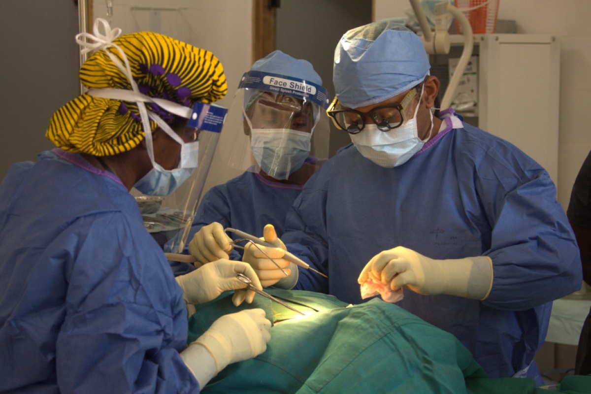 Dr. Gerald Ekwen, right, performs surgery at J.J. Dossen Hospital in Liberia