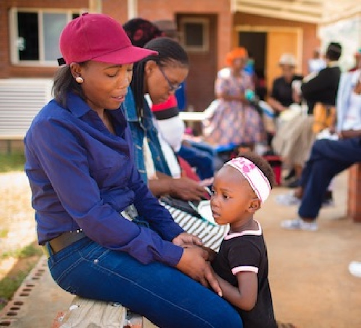 Patients outside the TB clinic at Botšabelo Hospital in Maseru, Lesotho