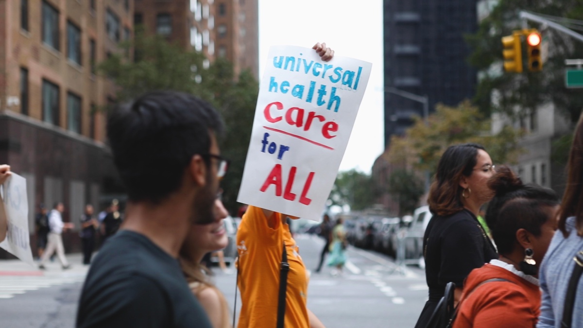 protestor in New York City marches for univeral health care