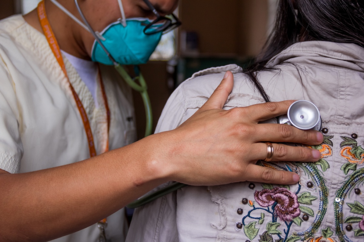 A TB patient is examined in Carabayllo, Peru
