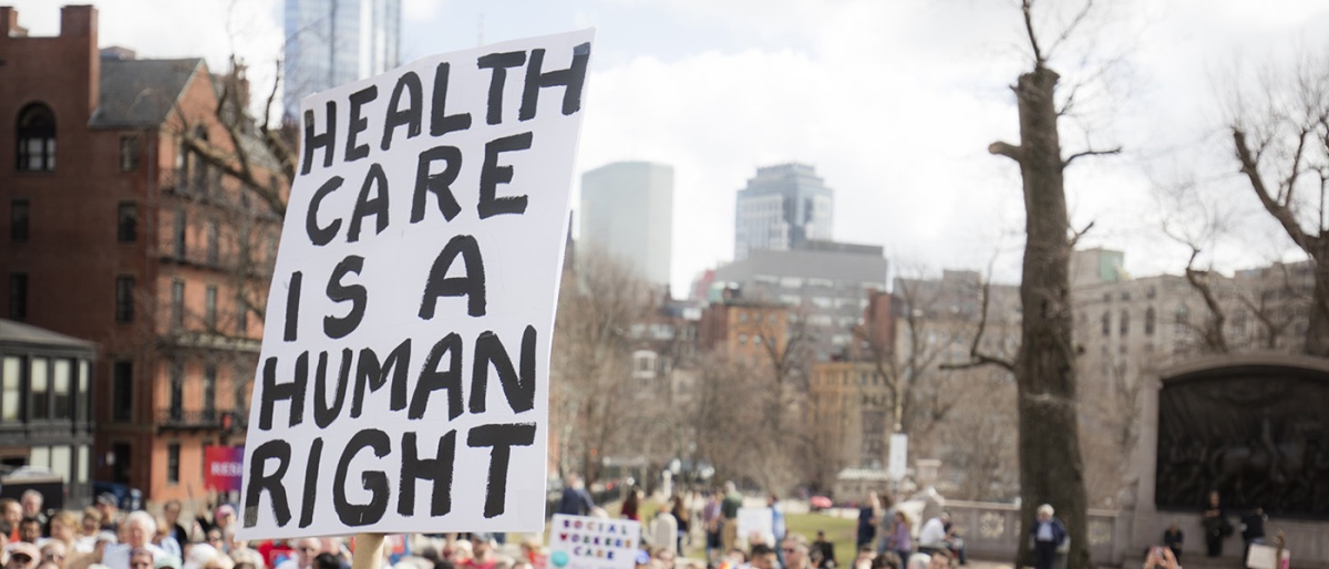 health care is a human right sign at State House rally in Boston