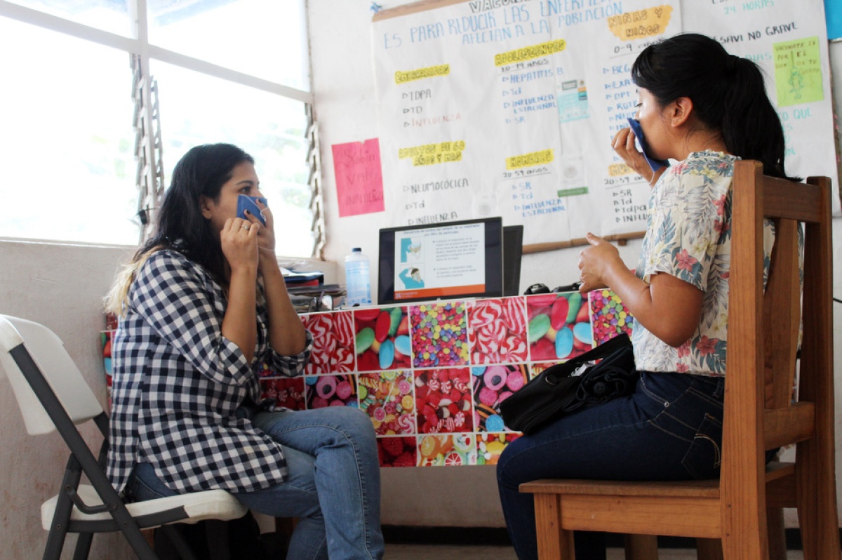 A doctor teaches a nurse how to wear a face mask as part of a larger training on how to manage triage areas in Chiapas, Mexico.