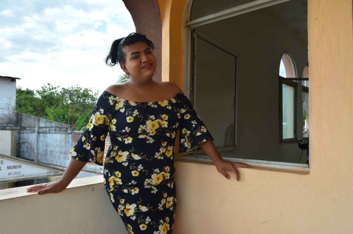 Alondra Esquinca smiles as she stands on a balcony overlooking Jaltenango, where Partners In Health works, in Chiapas, Mexico