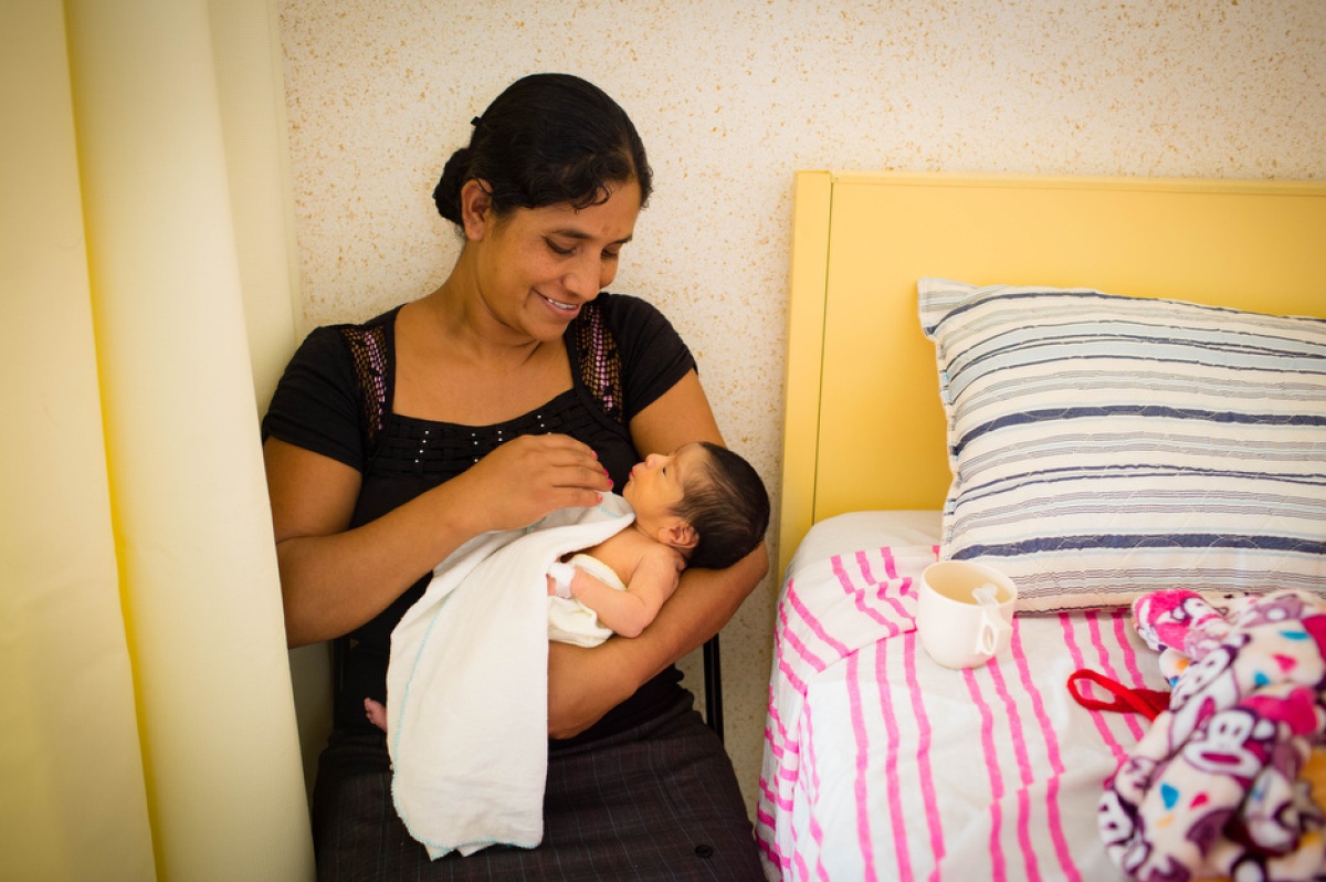 A patient, Debora Sanchez, holds her 5-day-old son at Casa Materna.