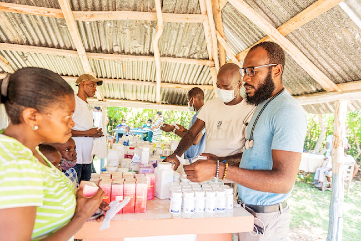clinicians distribute medical items in Haiti
