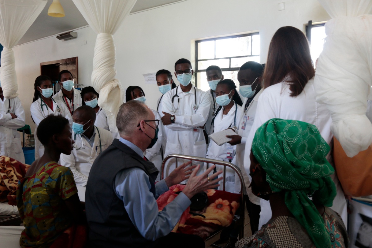 Dr. Paul Farmer teaches students from the University of Global Health Equity at a patient's bedside at Butaro District Hospital.