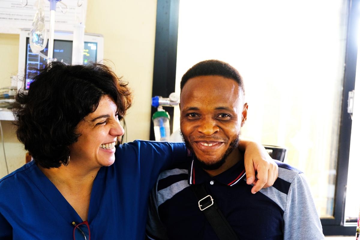 Dr. Marta Patiño and James Fatoma share a moment in the emergency ward at Koidu Government Hospital in Kono, Sierra Leone.