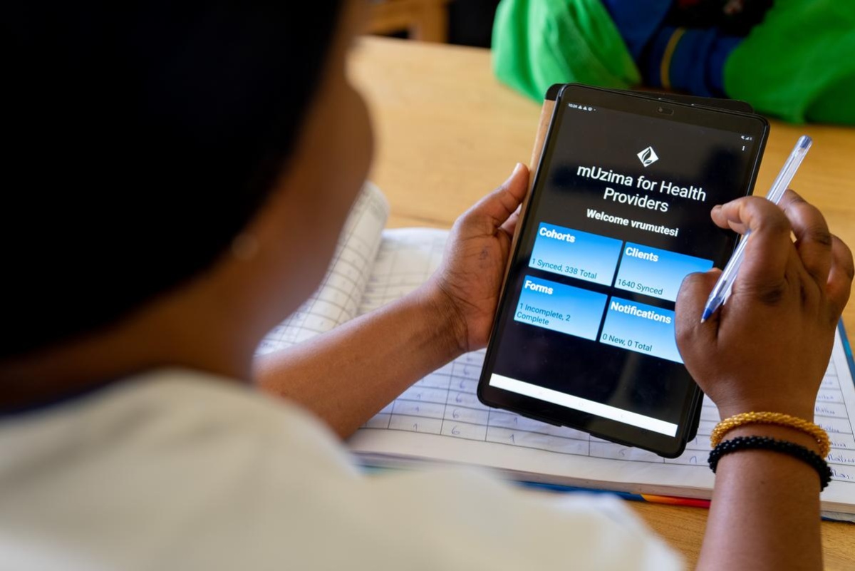 Raissa Umutesi, a nurse with the Women’s Cancer Program at Inshuti Mu Buzima, as Partners In Health is known in Rwanda, uses the mUzima app for managing patient data and screenings for early cancer detection.