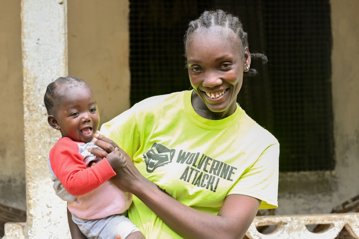 Rachel holding her child