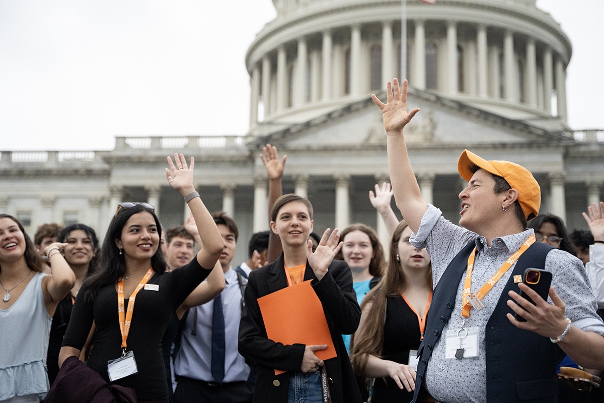 Following the weekend's Training Institute, Fynn Crooks, PIH advocacy senior community organizer, hypes up members of Engage ahead of their Hill Day with over 170 meetings with Congress.