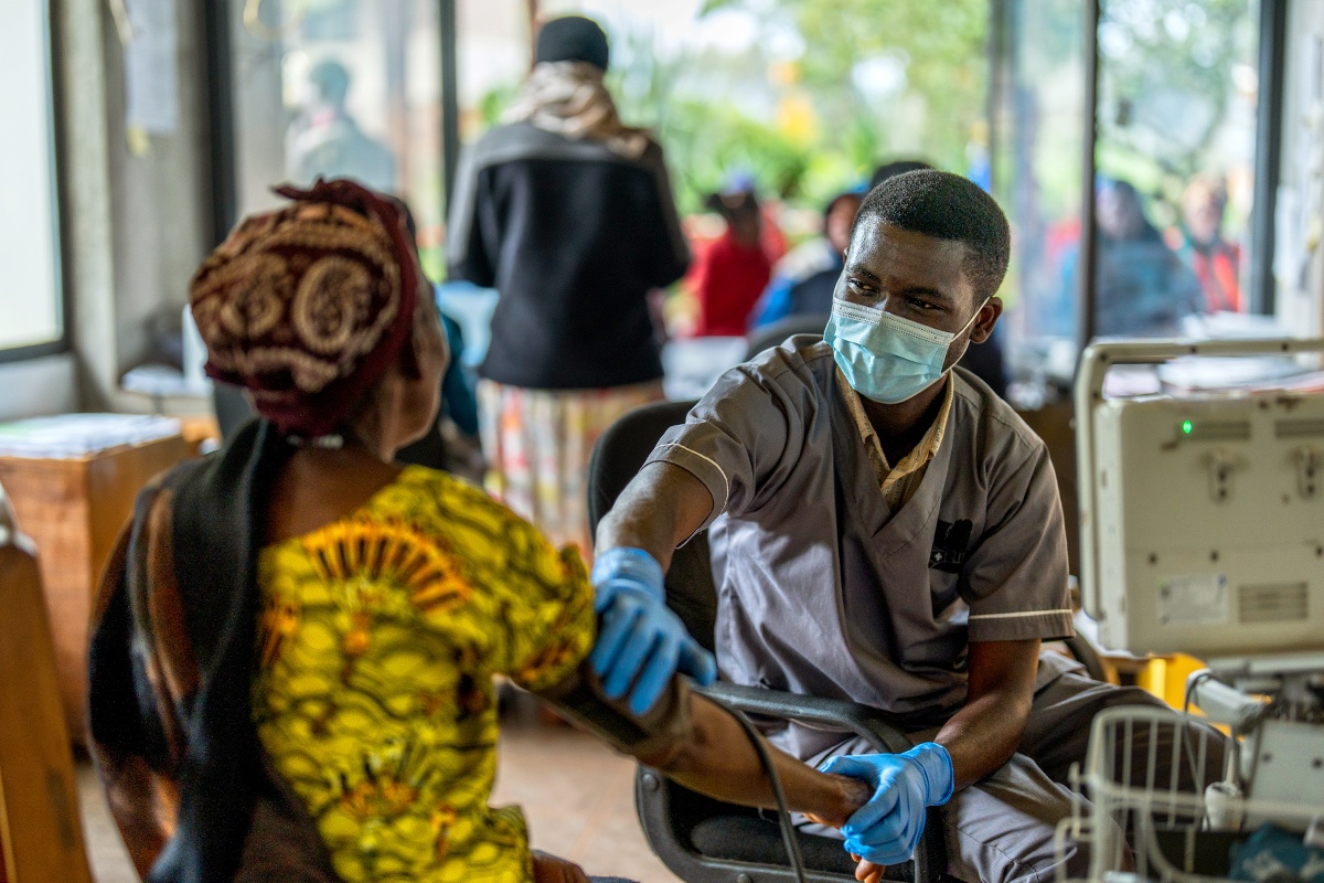 Nurse taking patient's blood pressure at Butaro Level II Teaching Hospital