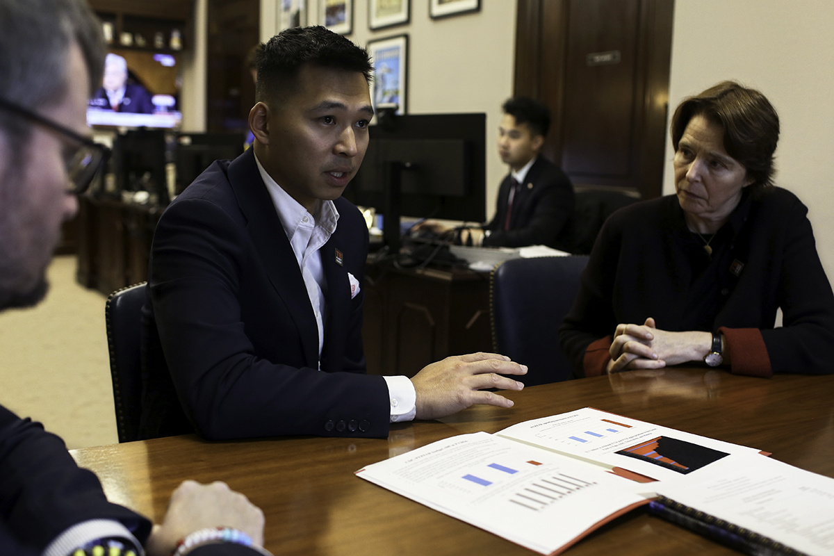 Vincent Lin, associate director of health policy and advocacy, center, and PIH Co-founder Ophelia Dahl, right, speak with a representative from the office of Senator Christopher Coons in Washington, D.C.