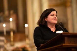 CEO Dr. Sheila Davis addresses an audience for the Haiti earthquake remembrance