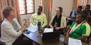 Dr. Ann Miller, left, leads a research training session