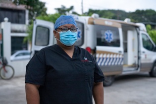 a paramedic stands for a portrait