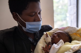 Nyirabizeyimana Fortunée and her daughter, Gwizimpano Nshizirungu Annick, rest in the kangaroo care ward at Butaro District Hospital in May 2021.