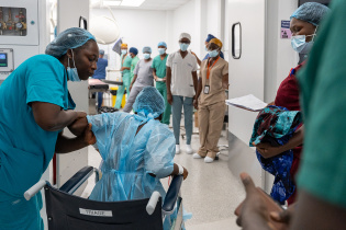 Patient Fanta Jimmy heads into the operating theater