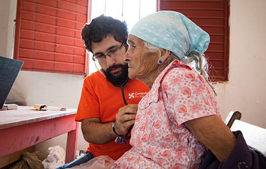 Elderly woman being treated