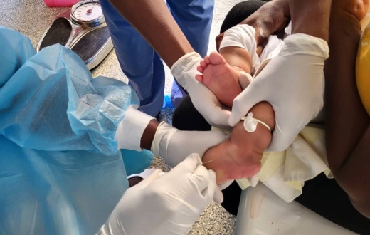 A child receives cholera treatment in Haiti