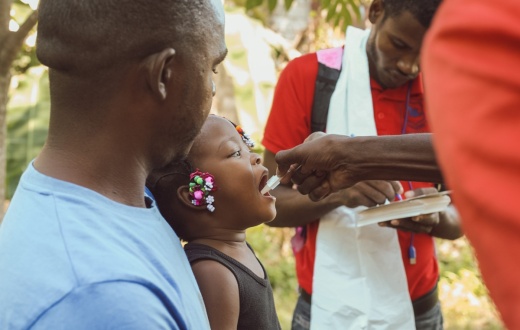 A 2-year-old child in Haiti gets a dose of the cholera vaccine.