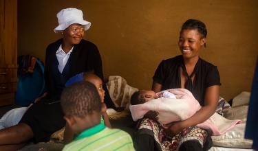 Mafelleng September and her children at their home