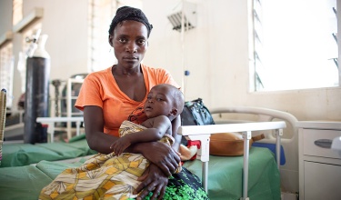 Chisomo Tigone, 7 months, sits with his mother, Flora, during his treatment for severe malaria. Chisomo Tigone, 7 months, sits with his mother, Flora, during his treatment for severe malaria.