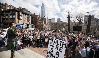 PIH Chief Medical Officer Dr. Joia Mukherjee speaks at a rally outside the Massachusetts State House.
