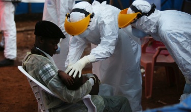 Doctors and nurses provide care to Ebola patients in West Africa