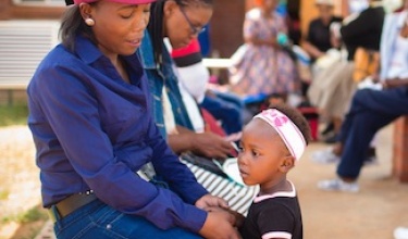 Patients outside the TB clinic at Botšabelo Hospital in Maseru, Lesotho