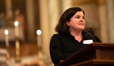 CEO Dr. Sheila Davis addresses an audience for the Haiti earthquake remembrance