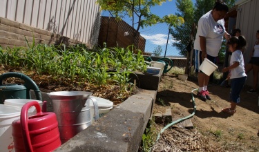 Marcy Martinez and her daughter garden in Ramah, New Mexico