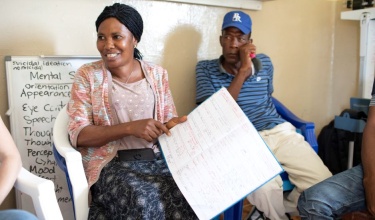 Kumba Judith Conteh with patient records