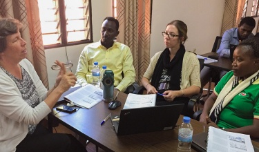 Dr. Ann Miller, left, leads a research training session