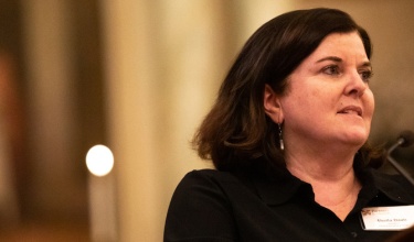 Shelia Davis stands at a podium