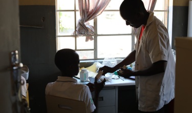 NCD nurse Victor Kaphaso with teen diabetes patient Kerefasi Wiliyamu at Lisungwi Community Hospital in Malawi