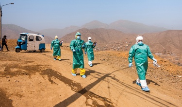 Health care workers with Socios En Salud in full PPE in Lima, Peru