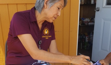 A side profile of Marlene Nez wearing a maroon shirt