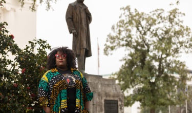 Michelle Browder stands in front of J. Marion Sims statue