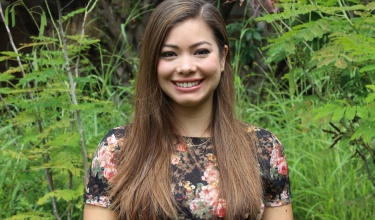 Valeria Macías, executive director of PIH in Mexico, smiles for a photo outside.