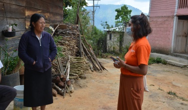 Sandra Vázquez, community manager with Compañeros En Salud, knocks on doors and provides education around COVID-19 vaccines for residents of Letrero