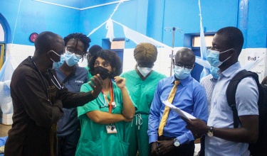 Dr. Marta Patiño and the clinical team discuss PIH's response following the explosion in Freetown.