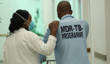 health care worker accompanies patient