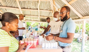 clinicians distribute medical items in Haiti