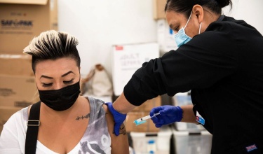 woman receives COVID-19 vaccination in Florida