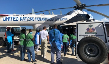 clinicians and patients outside helicopter 