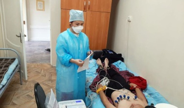 doctor administers ECG to TB patient in Kazakhstan