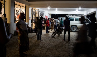 Patients arrive outside the emergency department at University Hospital in Mirebalais, Haiti. 