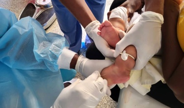 A child receives cholera treatment in Haiti