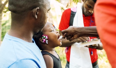 Johnson Guerrier and his two-year-old daughter received the oral cholera vaccine as part of a recent campaign in Mirabelais, Haiti. 